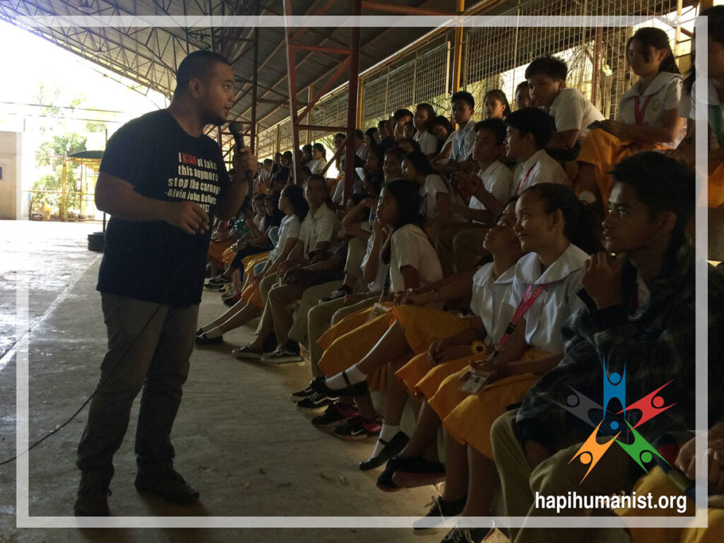 HAPI Executive Director AJ Ballares an conducting HIV / AIDS lecture in front of students