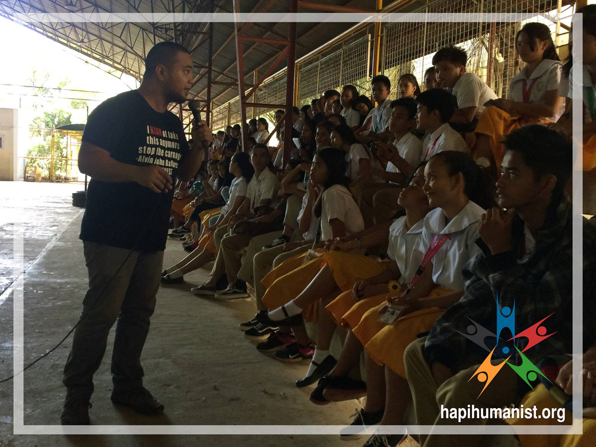 HAPI Executive Director AJ Ballares an conducting HIV / AIDS lecture in front of students